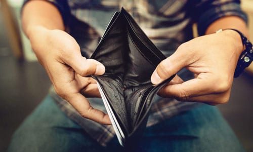 Man holding empty wallet